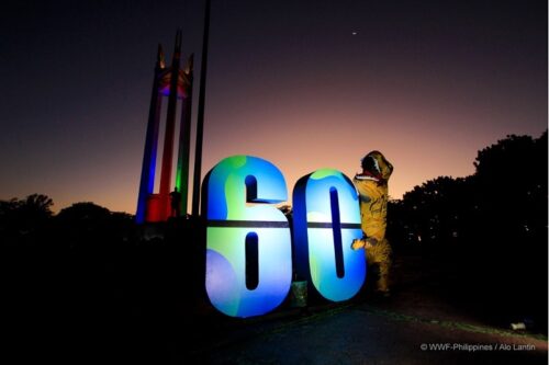 T-Rex Hugging '60' Earth Hour Logo At Quezon Memorial Circle